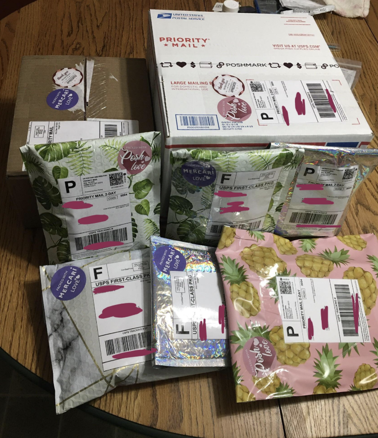 Assorted shipping boxes and patterned poly mailers ready for delivery, demonstrating high-volume sales through DropFlow.